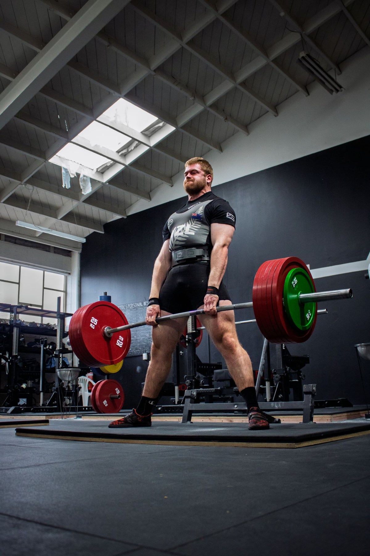 Lifter pulling a deadlift at Strength Metrics Gym